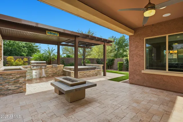 a view of a patio with a table and chairs