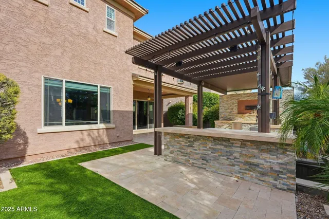 a view of house with backyard and porch