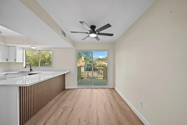 a kitchen with stainless steel appliances a refrigerator sink and stove