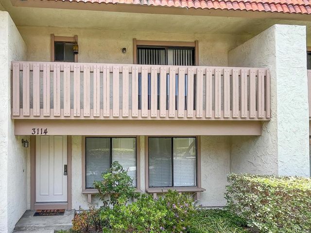 a balcony view with a garden space