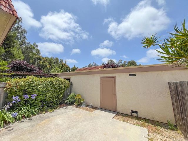 a swimming pool with outdoor seating and yard