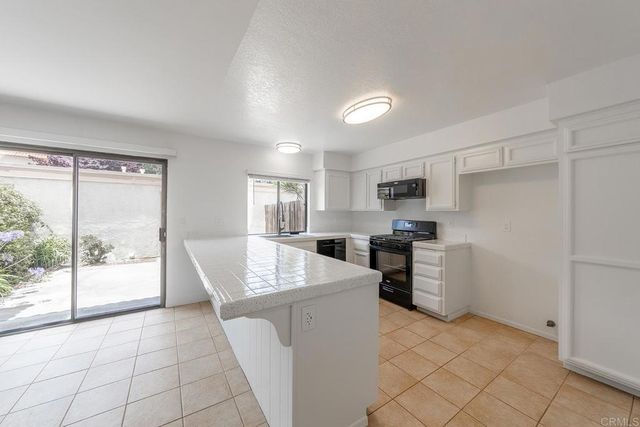 a view of an empty room with stairs