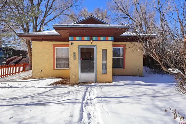 a view of a house with a iron gate
