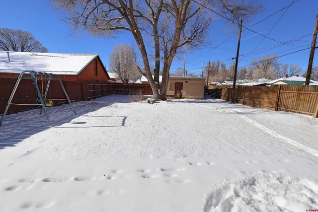 a view of a backyard of the house