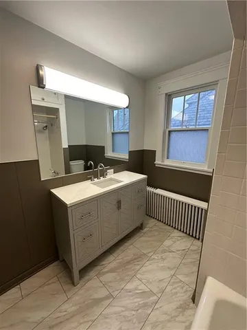 a kitchen with sink cabinets and window