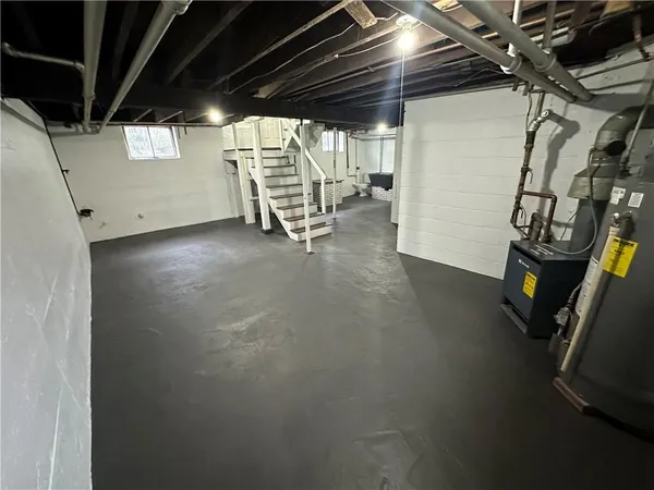 a view of empty room with wooden walls