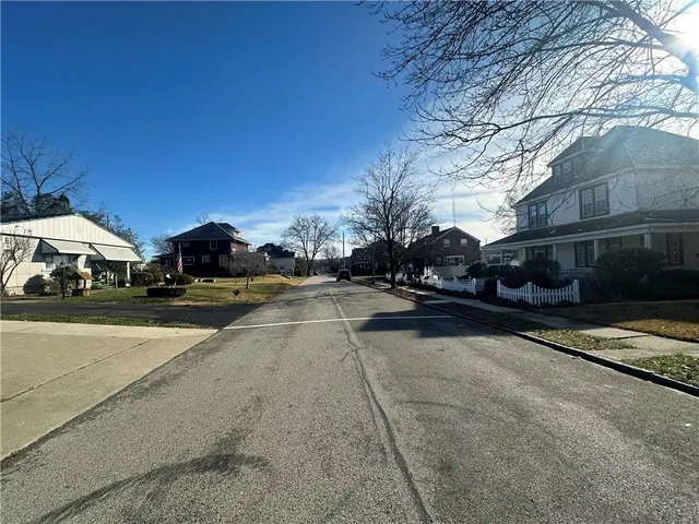a view of street with parked cars