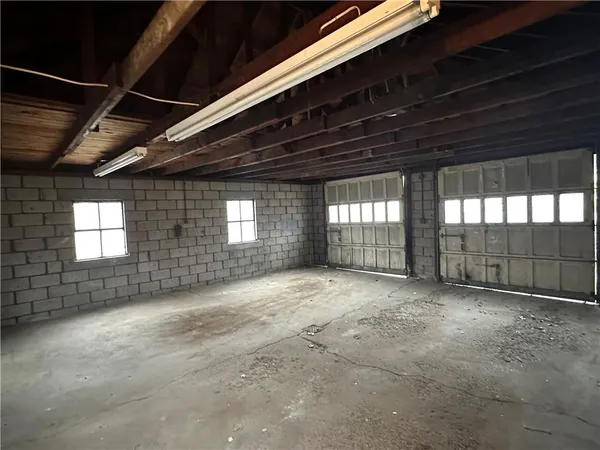 a view of an empty room with a fireplace