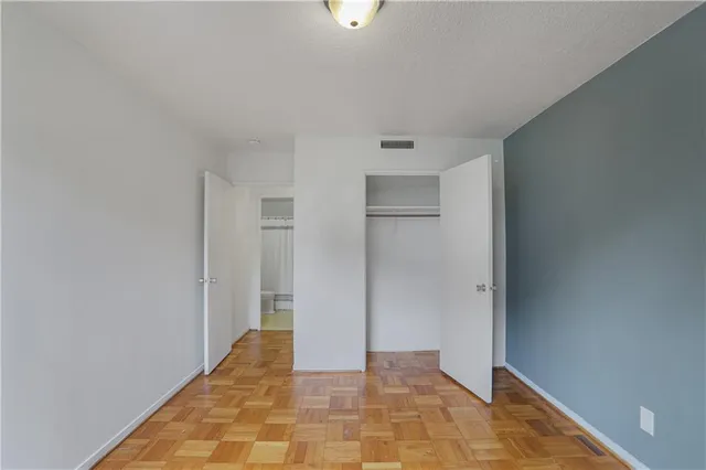 a bathroom with a sink a toilet and shower curtain