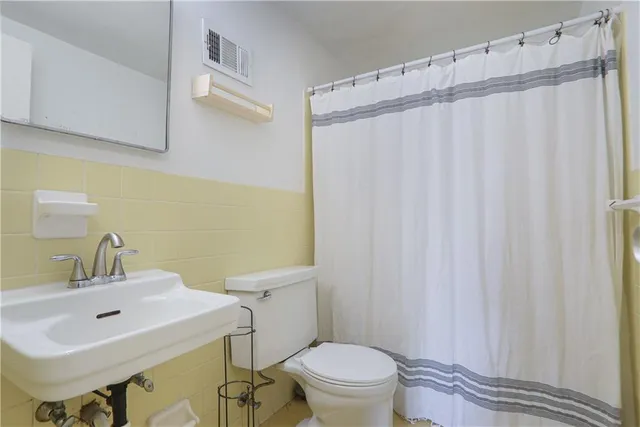 a view of swimming pool with chairs and fire pit