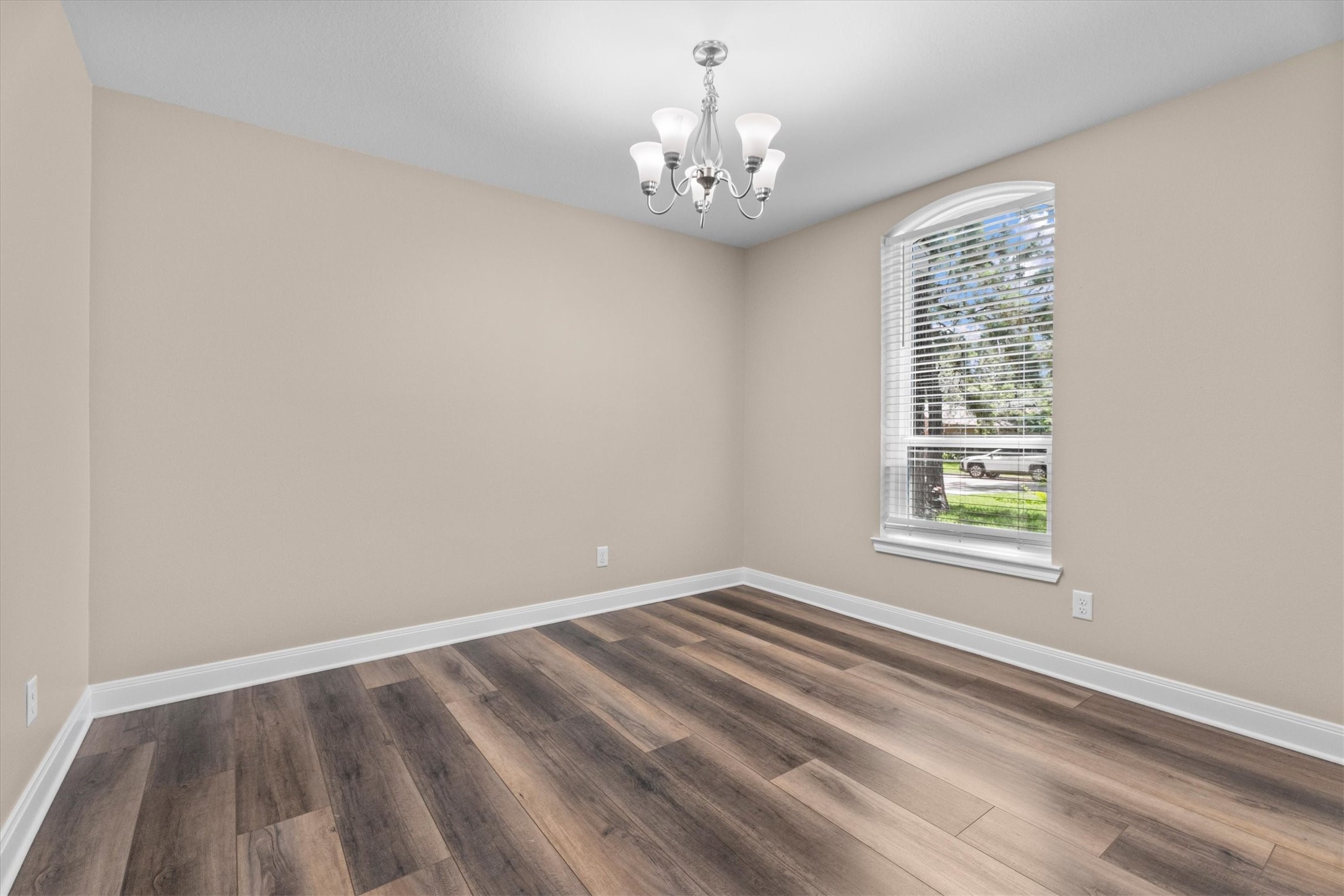 6530 Bayonne Drive Spring, TX 77389 - Photo 13 of 37 wooden floor in an empty room with a window