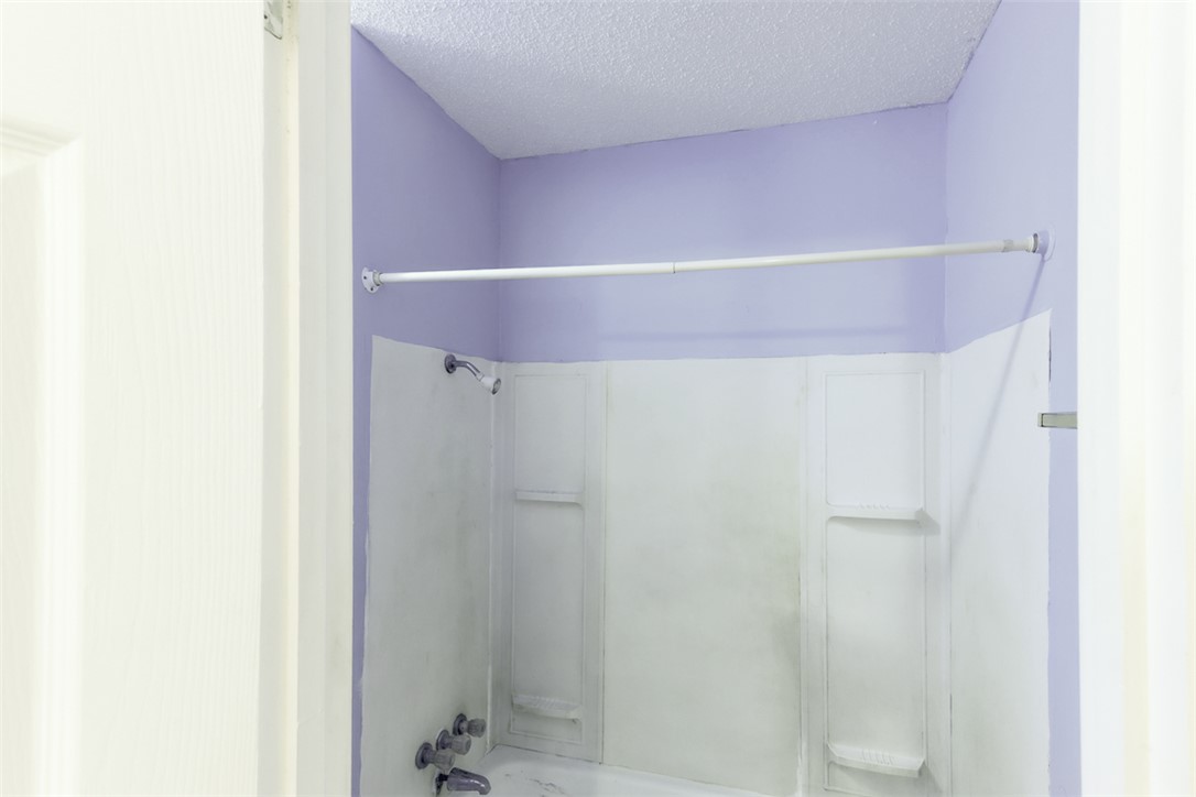 2402 Wilkes Street Bryan, TX 77803 - Photo 18 of 24 a bathroom with a shower