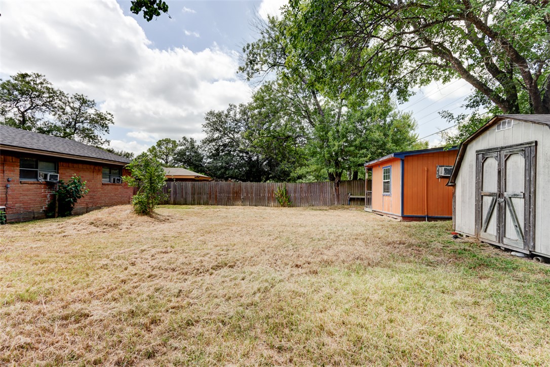 2402 Wilkes Street Bryan, TX 77803 - Photo 21 of 24 a backyard of a house with lots of green space