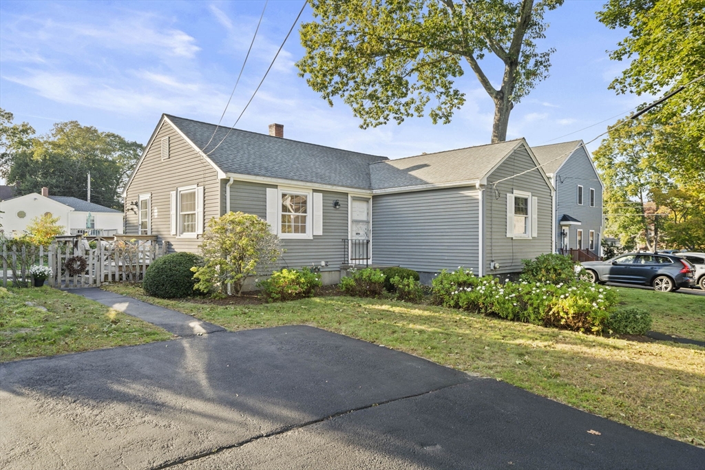 7 Drake Street Braintree, MA 02184 - Photo 1 of 26 a front view of a house with a yard and garage