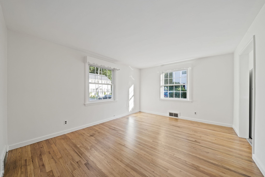 7 Drake Street Braintree, MA 02184 - Photo 13 of 26 a view of an empty room with wooden floor and a window