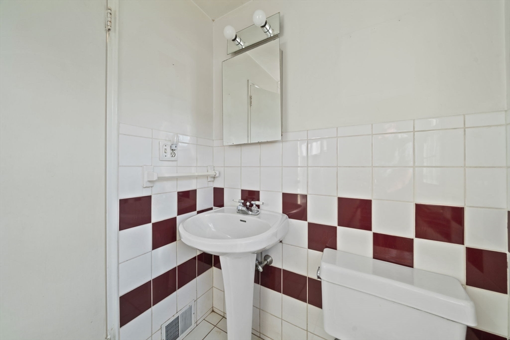 7 Drake Street Braintree, MA 02184 - Photo 17 of 26 a bathroom with a sink toilet and shower