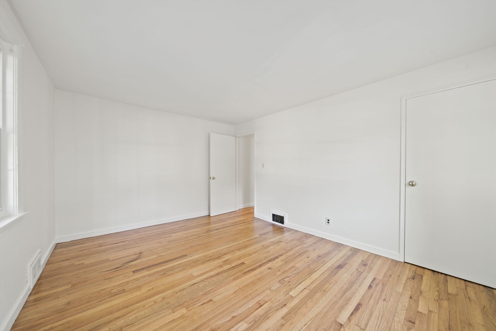 7 Drake Street Braintree, MA 02184 - Photo 19 of 26 a view of an empty room with wooden floor