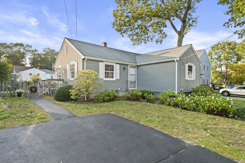 7 Drake Street Braintree, MA 02184 - Photo 26 of 26 a front view of a house with a yard and garage