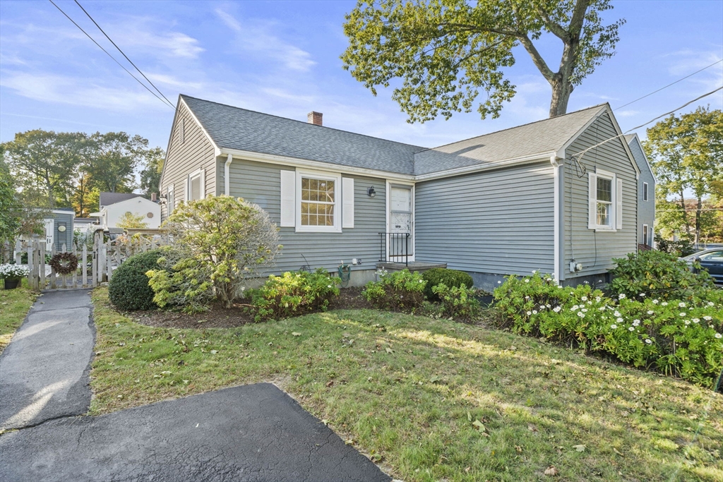 7 Drake Street Braintree, MA 02184 - Photo 3 of 26 a front view of a house with garden