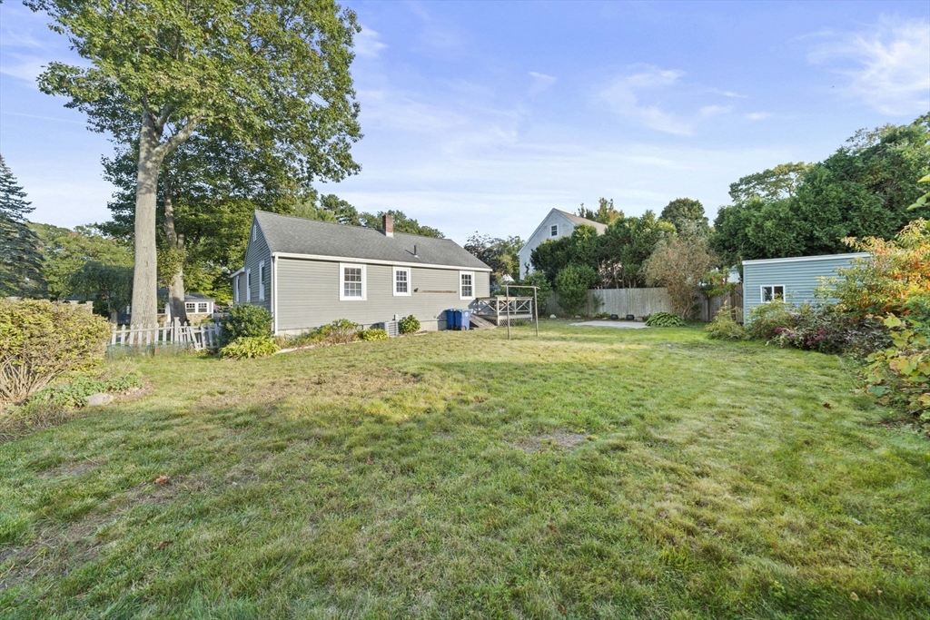7 Drake Street Braintree, MA 02184 - Photo 5 of 26 a house view with swimming pool and trees in the background