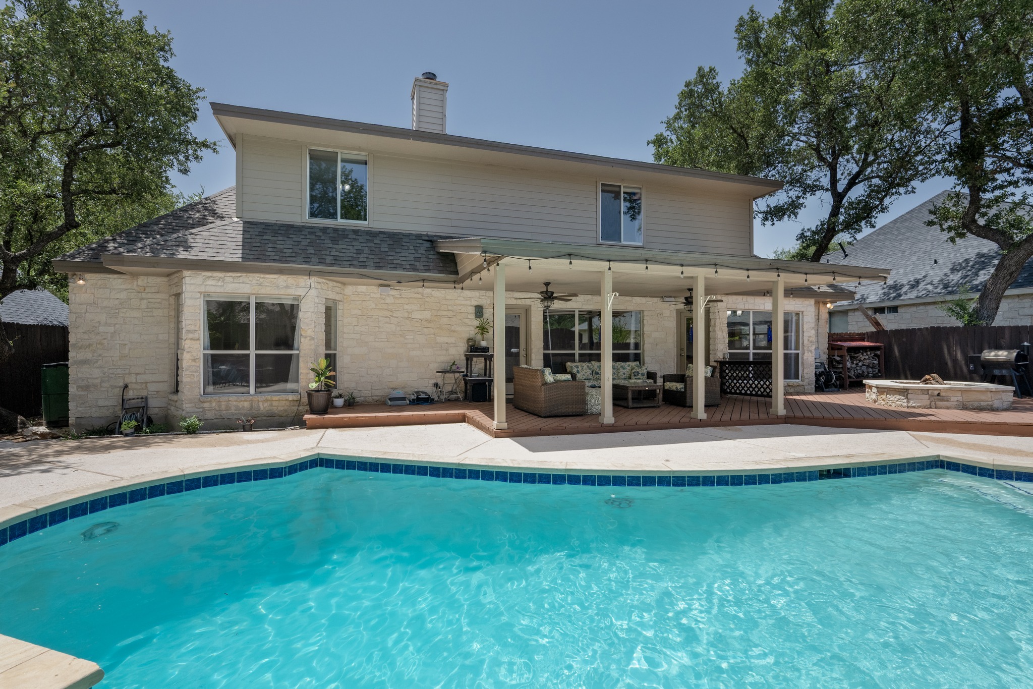 108 Thornwood Road Georgetown, TX 78628 - Photo 34 of 40 A spacious outdoor living area offers a covered patio and a sparkling inground pool.