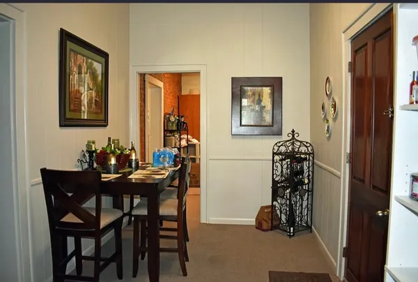 a view of a livingroom with furniture and a window