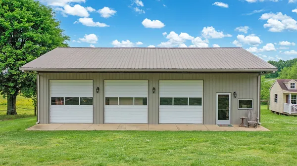 a view of a house with backyard of a house