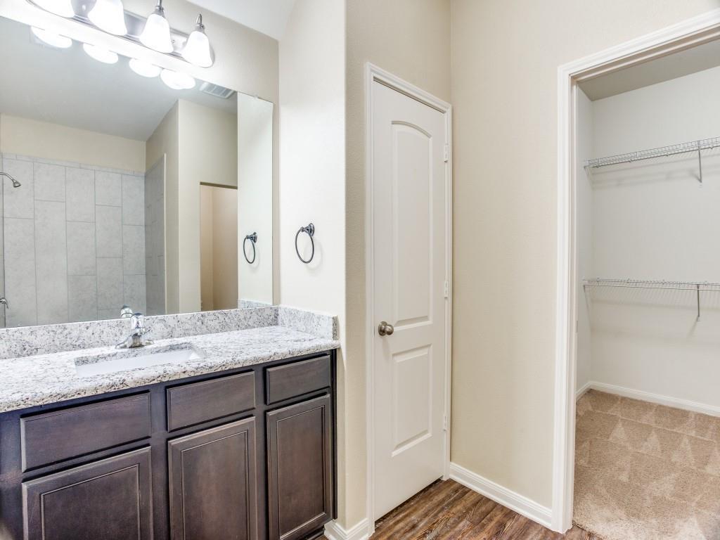 1717 Conley Lane Crowley, TX 76036 - Photo 8 of 11 a bathroom with a granite countertop sink and a mirror