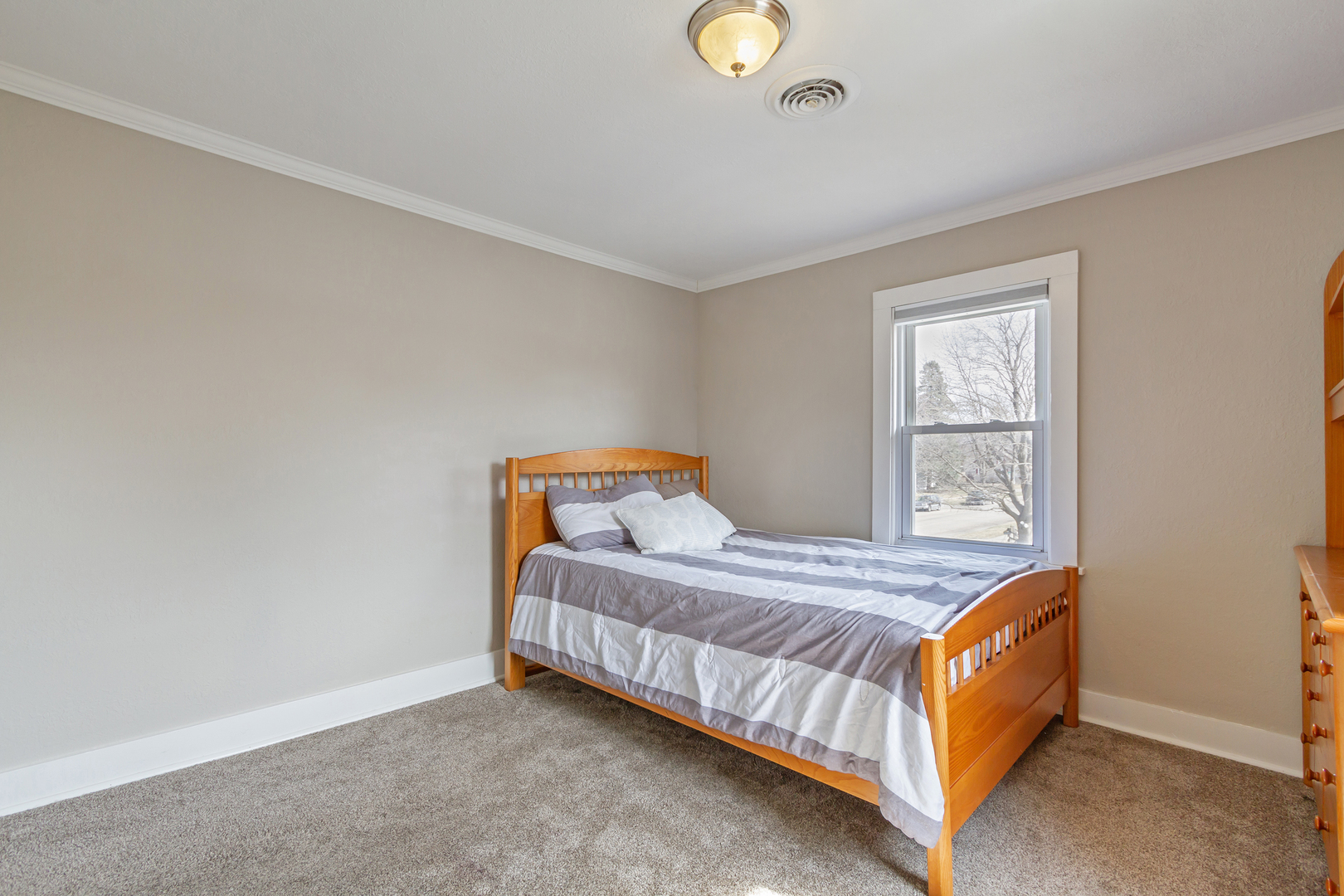 728 Woolf Court Rochelle, IL 61068 - Photo 11 of 31 a bedroom with a bed and window