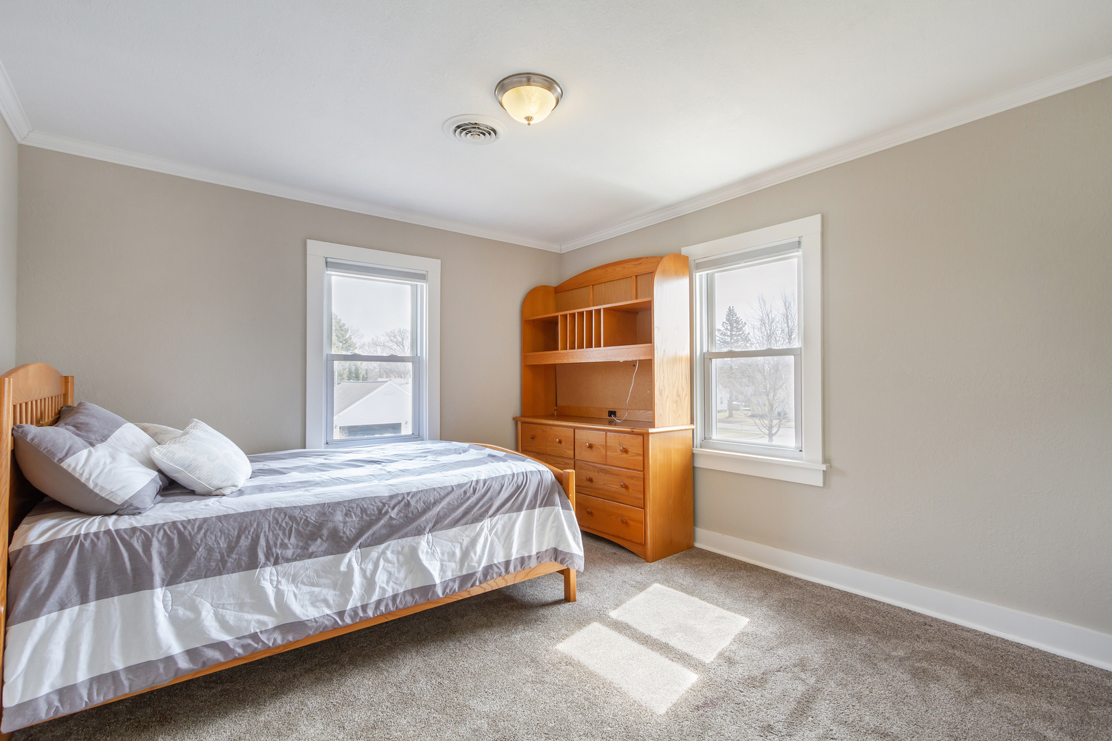 728 Woolf Court Rochelle, IL 61068 - Photo 12 of 31 a bedroom with a bed and a window