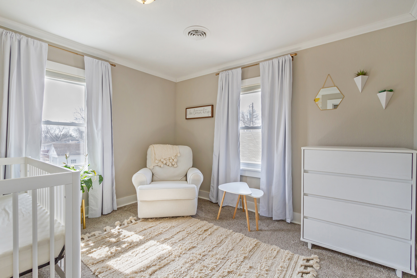 728 Woolf Court Rochelle, IL 61068 - Photo 14 of 31 a living room with a baby crib furniture and a window