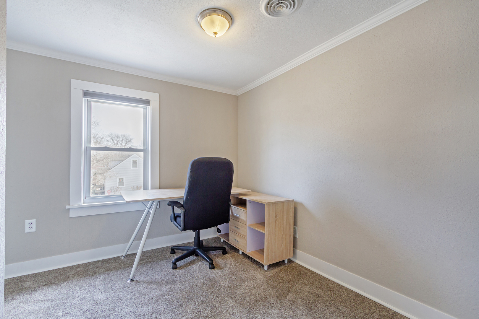728 Woolf Court Rochelle, IL 61068 - Photo 15 of 31 a view of a workspace with furniture and a window