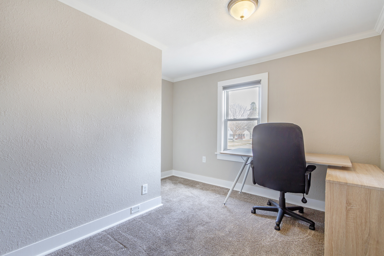 728 Woolf Court Rochelle, IL 61068 - Photo 16 of 31 a view of a workspace with furniture and a window