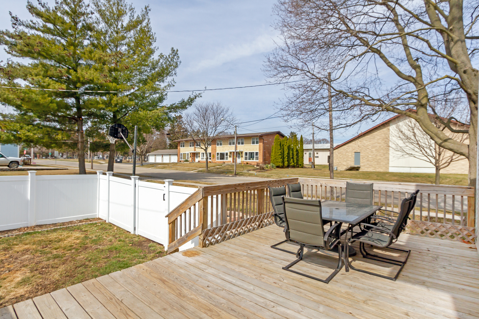 728 Woolf Court Rochelle, IL 61068 - Photo 21 of 31 a view of a patio with table and chairs with wooden floor and fence