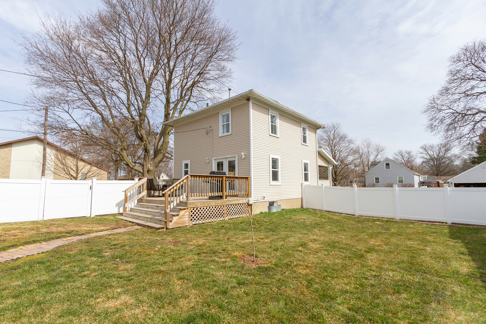 728 Woolf Court Rochelle, IL 61068 - Photo 23 of 31 a view of a house with a large tree and a yard