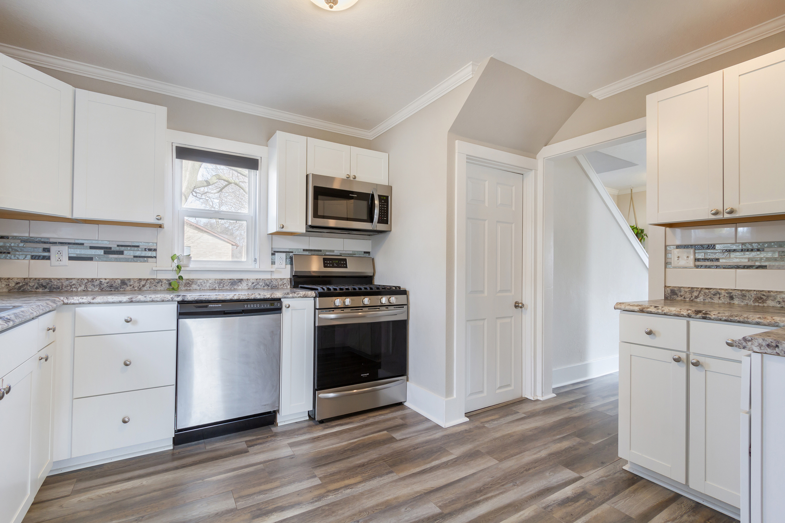 728 Woolf Court Rochelle, IL 61068 - Photo 9 of 31 a kitchen with granite countertop a refrigerator stove and sink