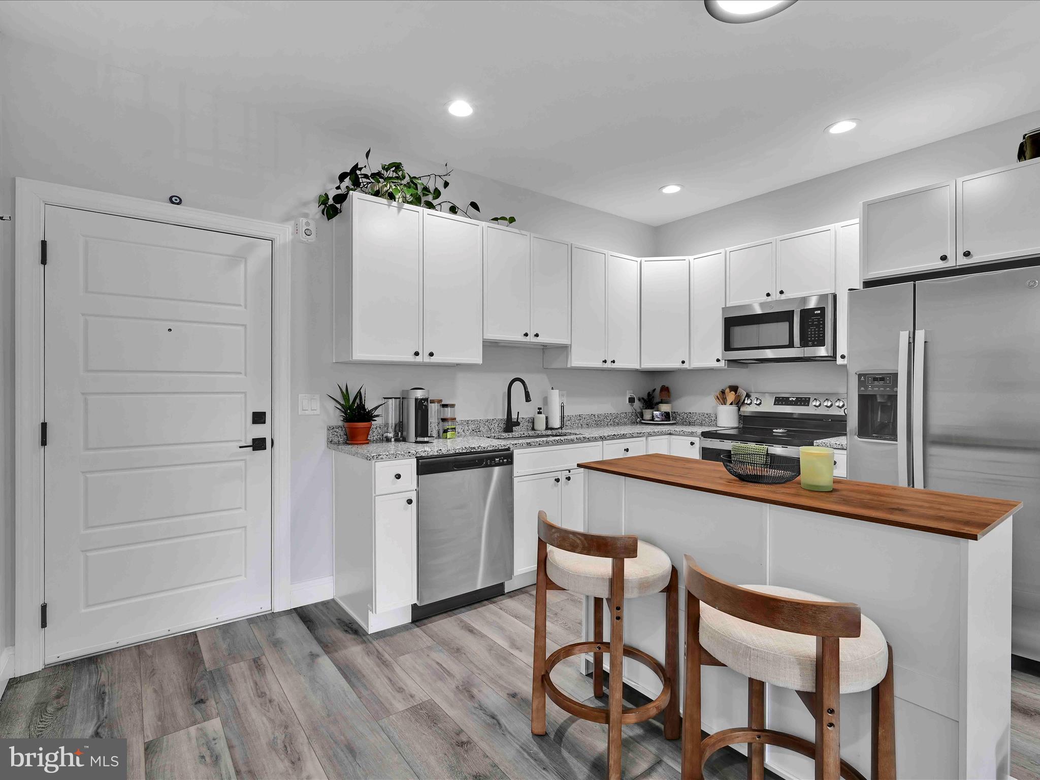 500-800 Paramount Boulevard, Unit 101312 Orwigsburg, PA 17961 - Photo 12 of 66 a kitchen with granite countertop a refrigerator stove top oven and sink