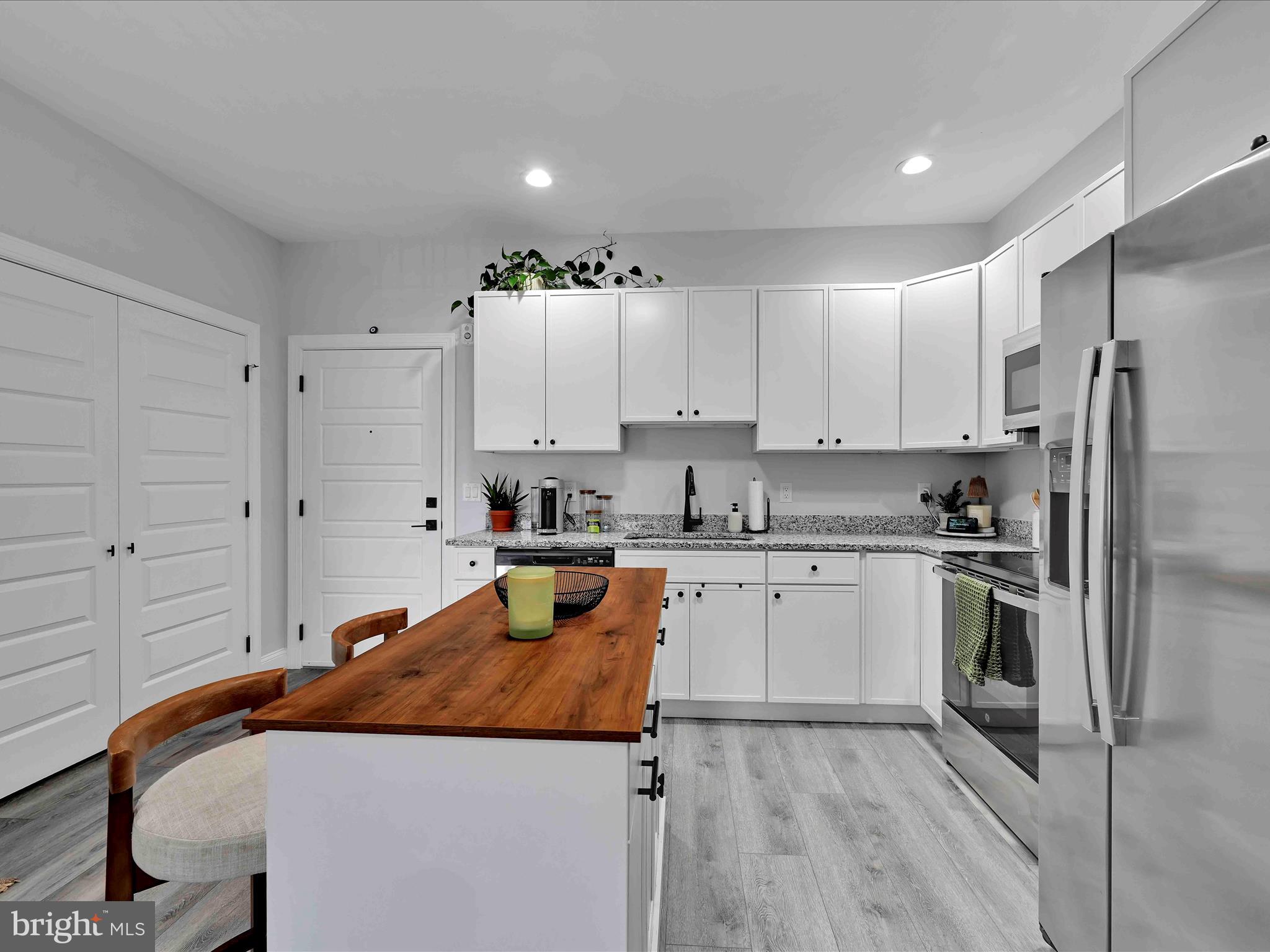 500-800 Paramount Boulevard, Unit 101312 Orwigsburg, PA 17961 - Photo 14 of 66 a kitchen with stainless steel appliances granite countertop a sink and a refrigerator