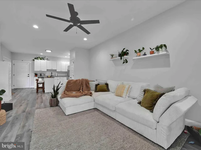 a kitchen with stainless steel appliances granite countertop a refrigerator sink and stove