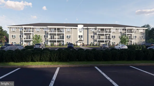 a front view of building with yard