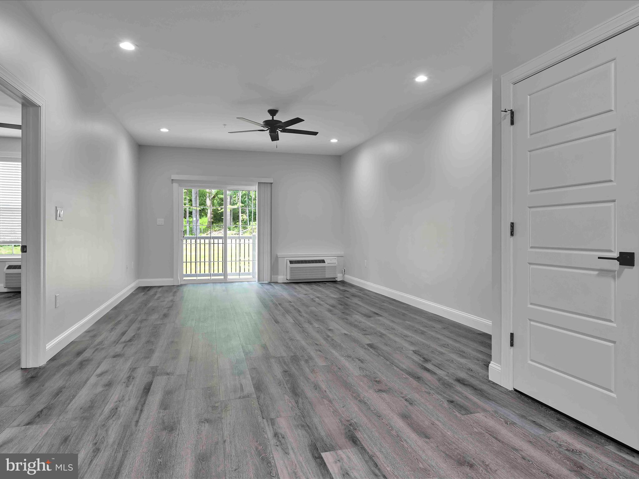 500-800 Paramount Boulevard, Unit 101312 Orwigsburg, PA 17961 - Photo 27 of 66 wooden floor in an empty room with a window