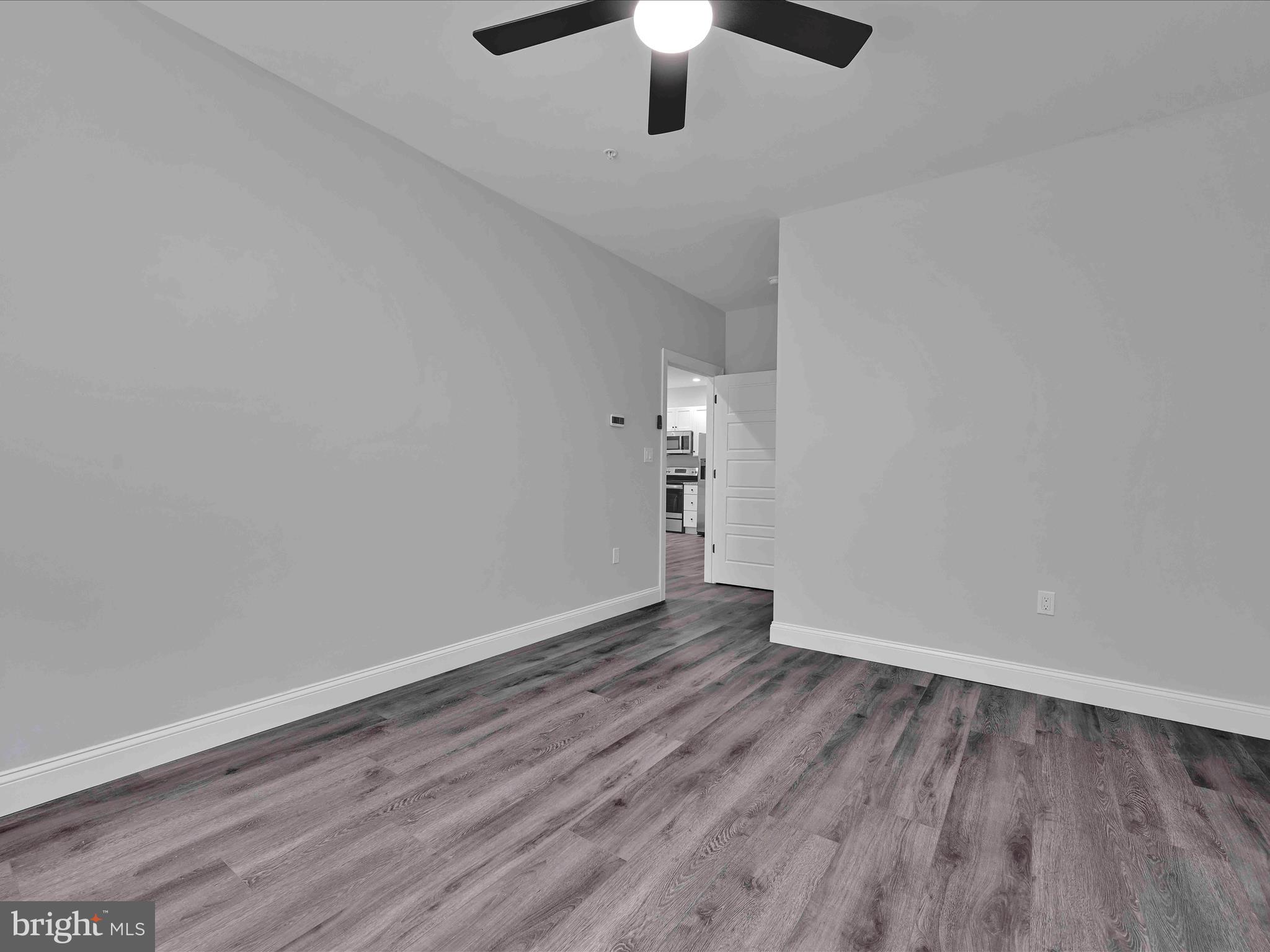 500-800 Paramount Boulevard, Unit 101312 Orwigsburg, PA 17961 - Photo 30 of 66 a view of an empty room with wooden floor