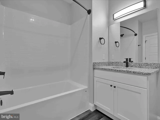 a large kitchen with a table and chairs