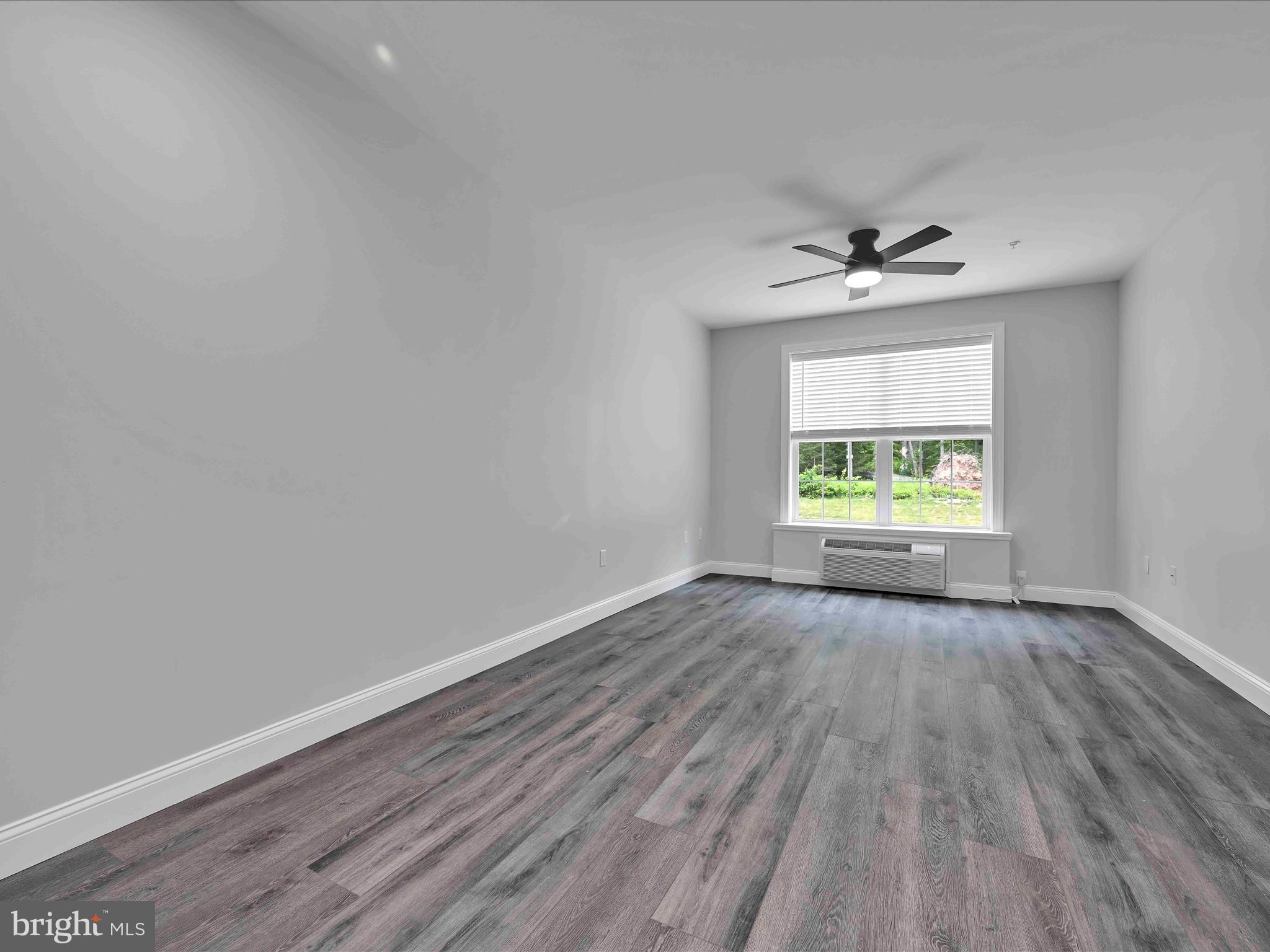 500-800 Paramount Boulevard, Unit 101312 Orwigsburg, PA 17961 - Photo 33 of 66 wooden floor in an empty room with a window