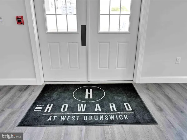 a view of a livingroom with dining table and chairs