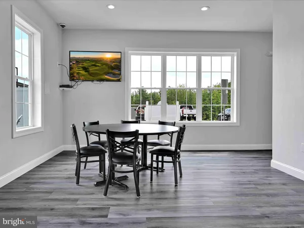 a view of a room with gym equipment and a large window