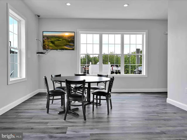 a view of a room with gym equipment and a large window