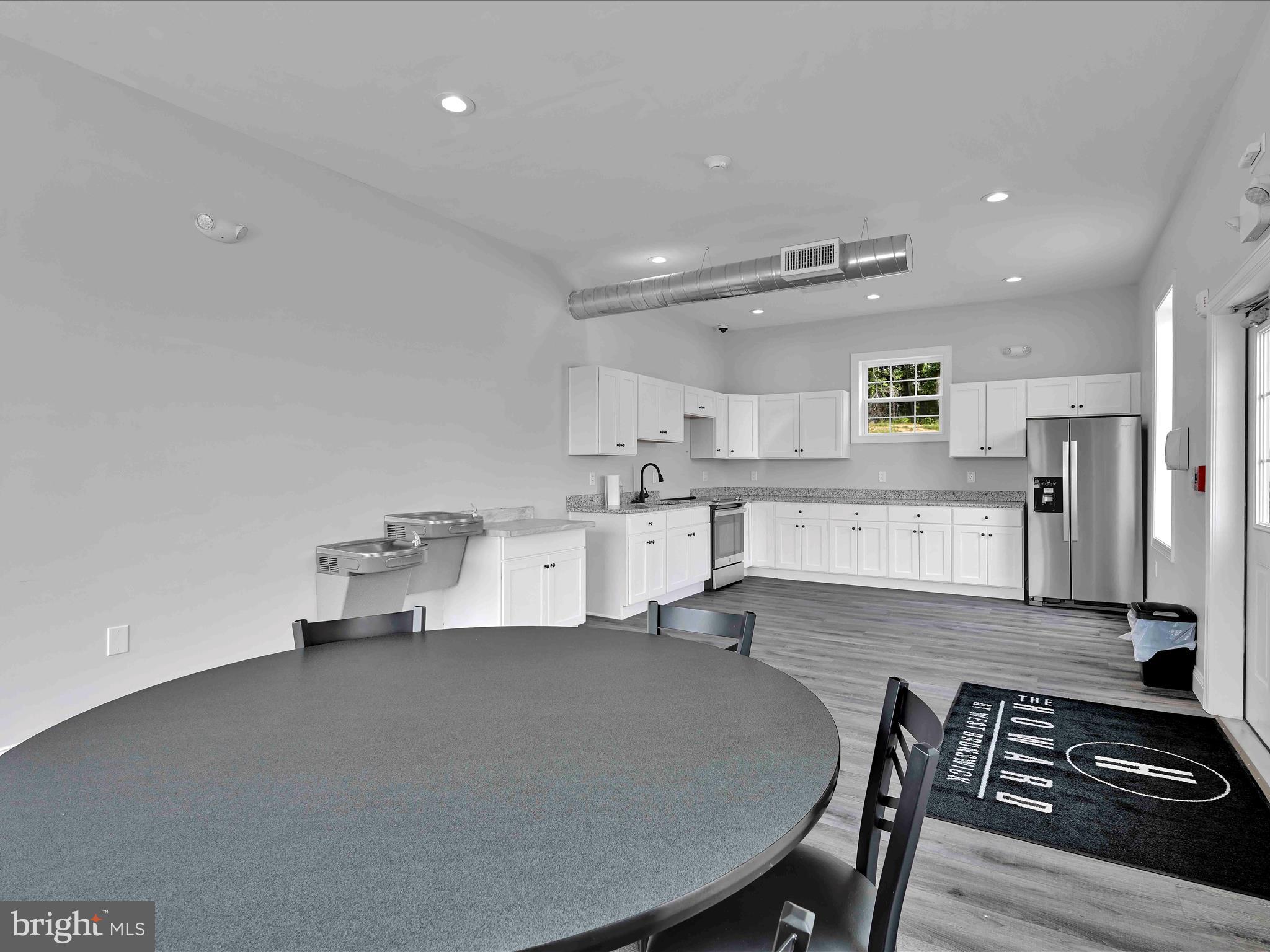 500-800 Paramount Boulevard, Unit 101312 Orwigsburg, PA 17961 - Photo 46 of 66 a large kitchen with a table and chairs