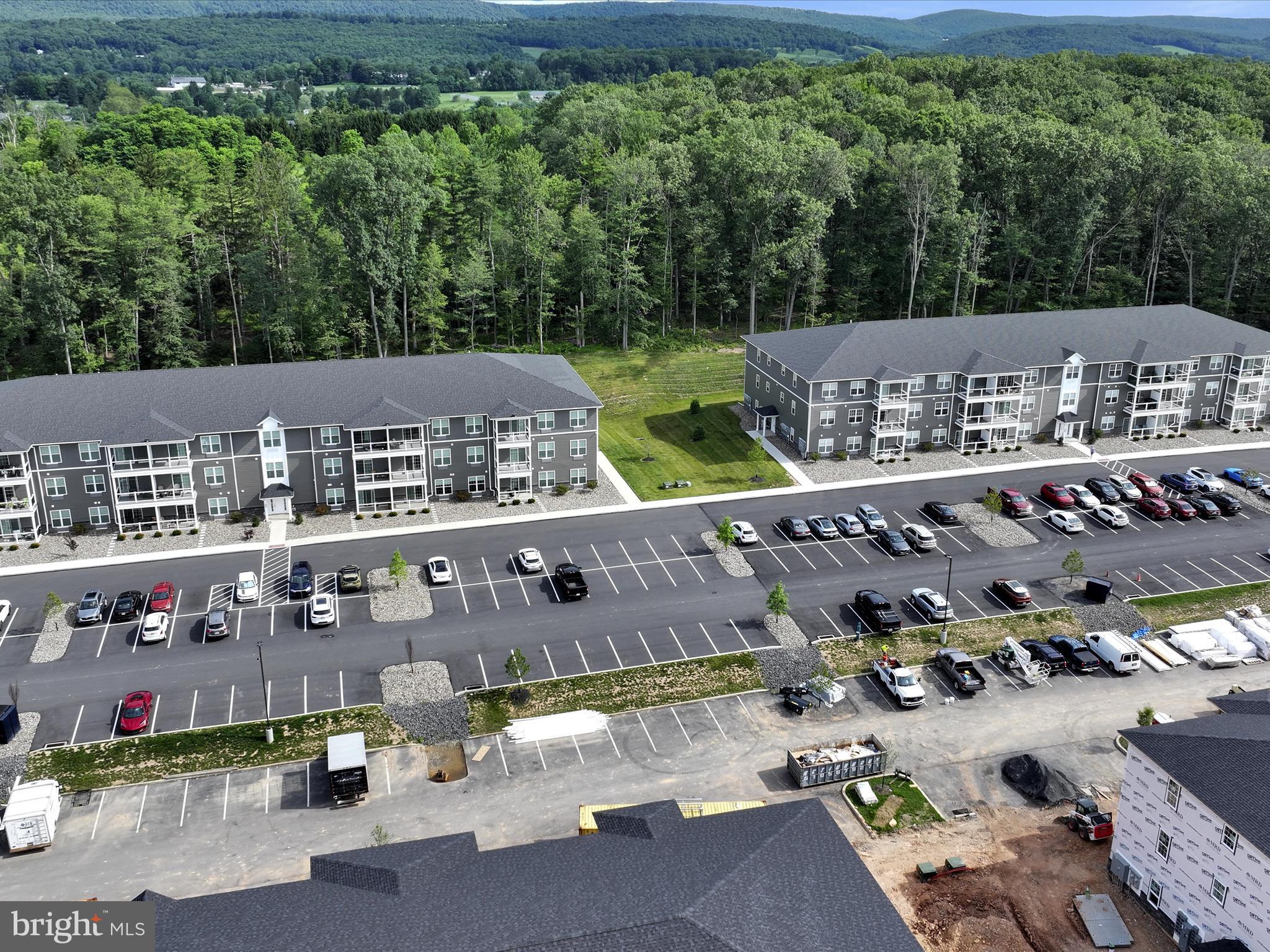 500-800 Paramount Boulevard, Unit 101312 Orwigsburg, PA 17961 - Photo 65 of 66 an aerial view of a house with a garden