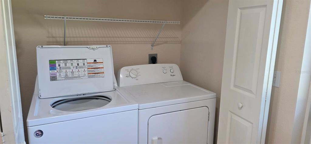 26172 Explorer Road, Unit 4 Punta Gorda, FL 33983 - Photo 5 of 11 a utility room with dryer and washer